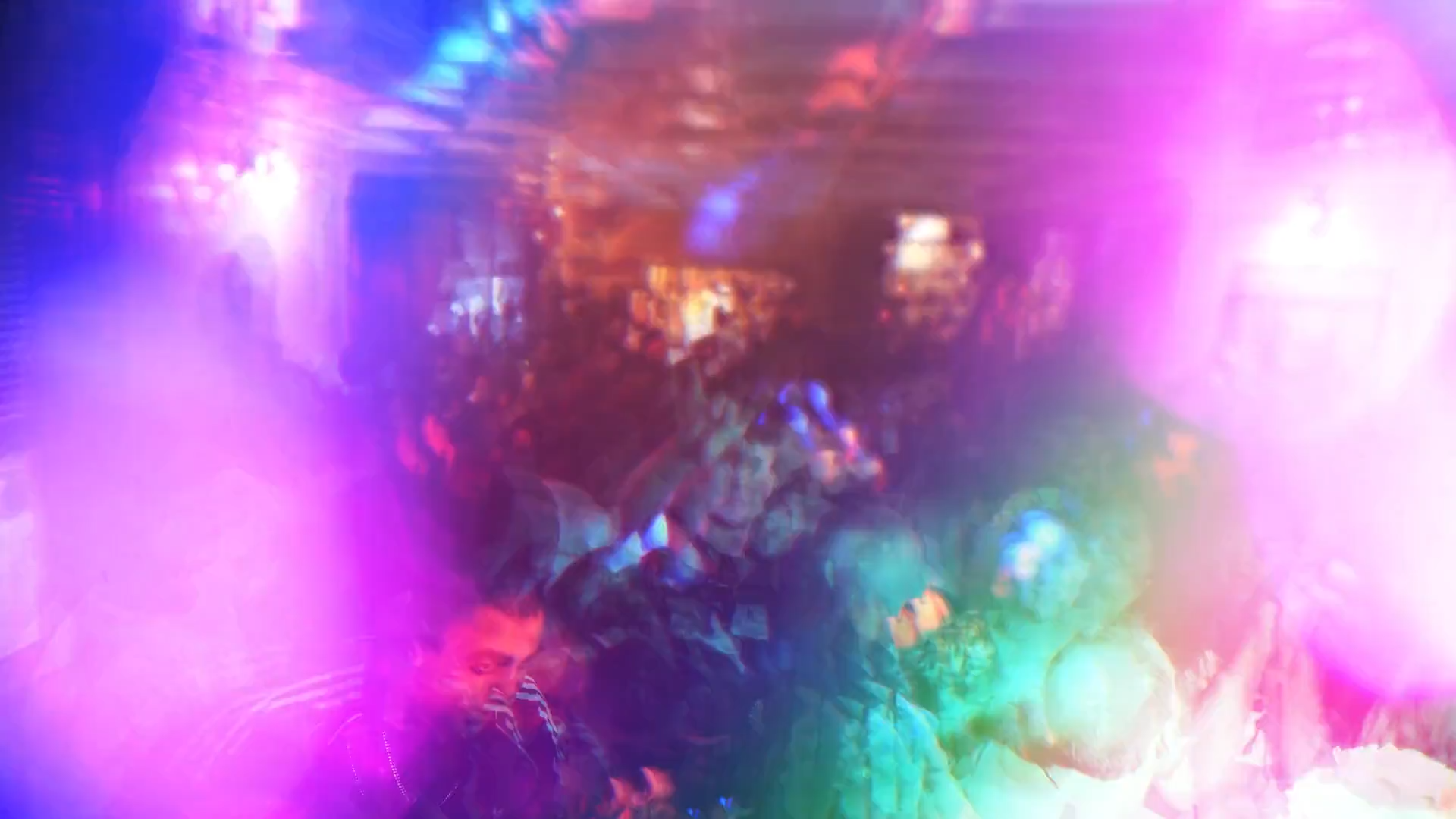 Crowd inside The Gator Club under stage lights